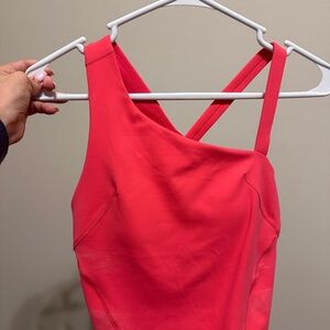 Lululemonalign tank hot pink(pic makes it look red). Never worn don’t have tags